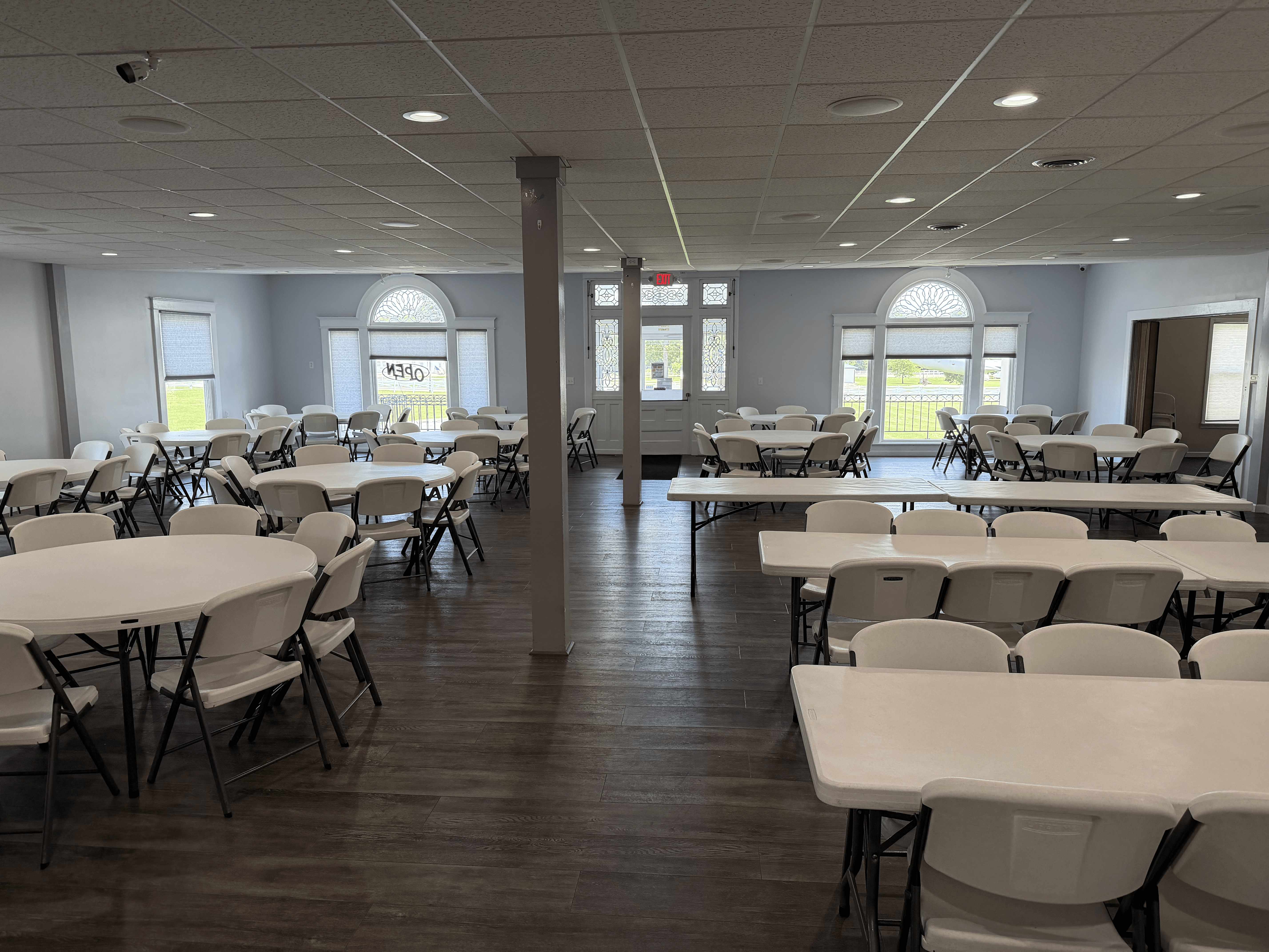 Interior event hall at American Legion Post #211 set with tables and chairs, available for gatherings